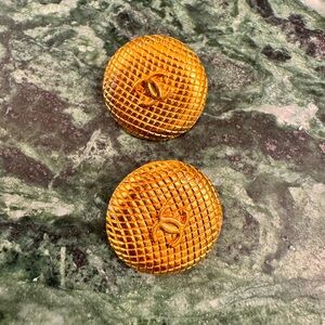 Gold CHANEL buttons.